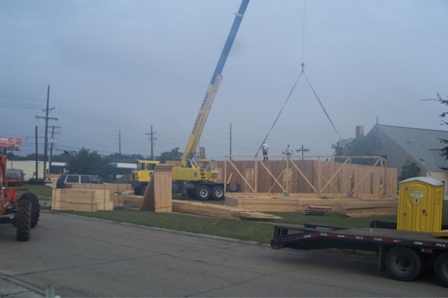 Truck crane used to set roof trusses